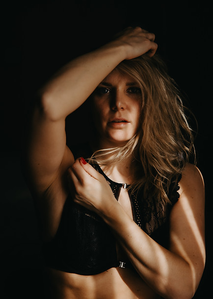 portrait of strong woman boudoir black lace lingerie