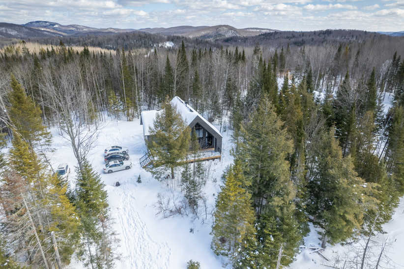 Real Estate photography. 
Aerial Drone photography for  Le Mitik, an AirBnb rental cabin in a forest in Quebec, Canada. High quality photography taken by Kaso Innovations Media Producers