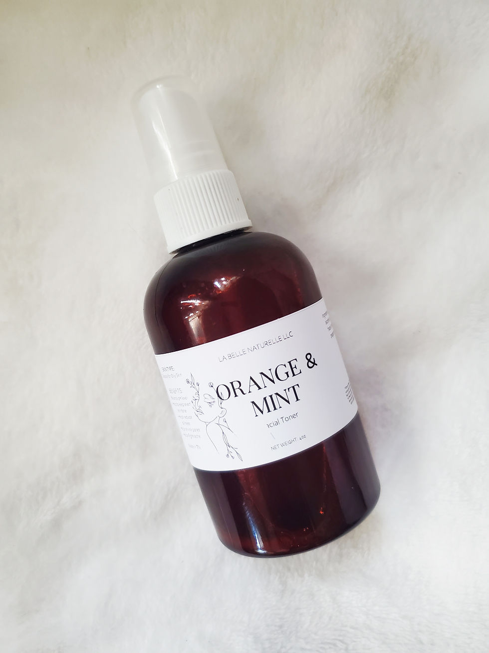amber bottle on a white back drop