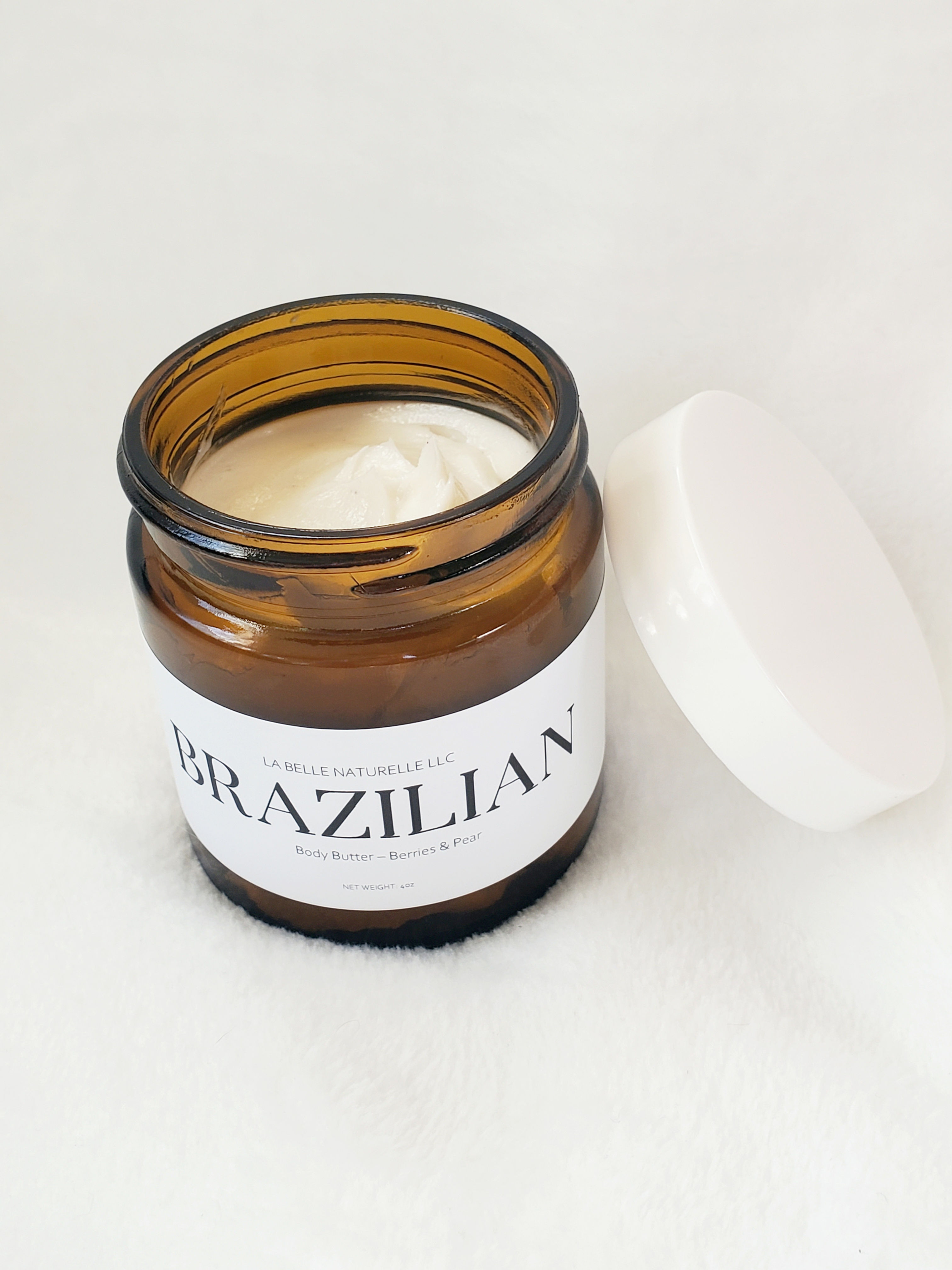amber jar open top seeing product on white back drop