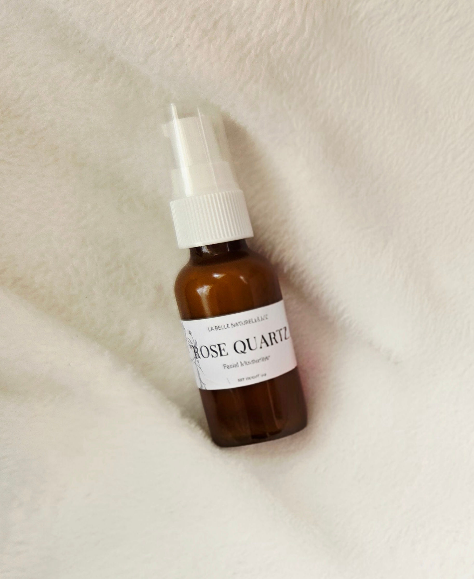 amber bottle white top on a white back drop