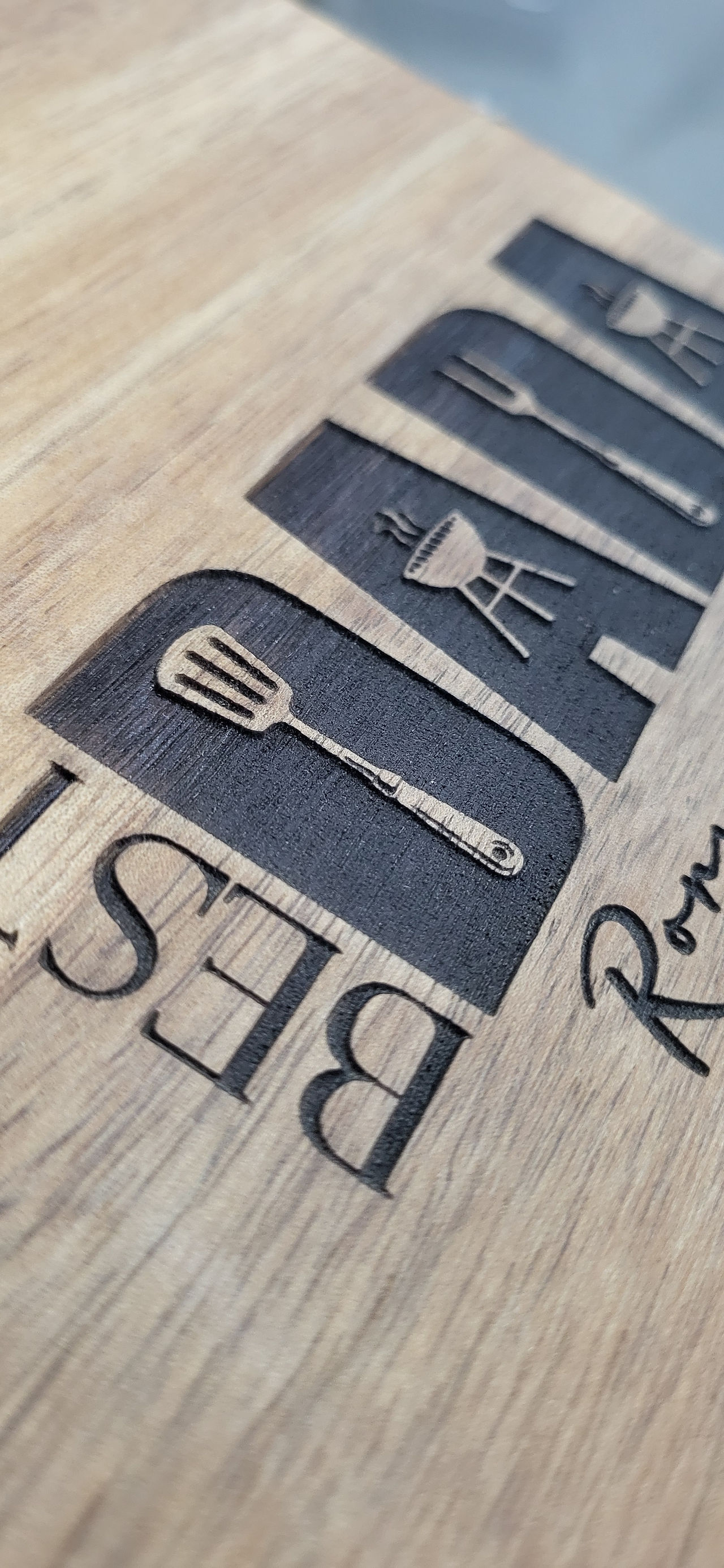 close of details and burn depth of an engraving on a wooden food board