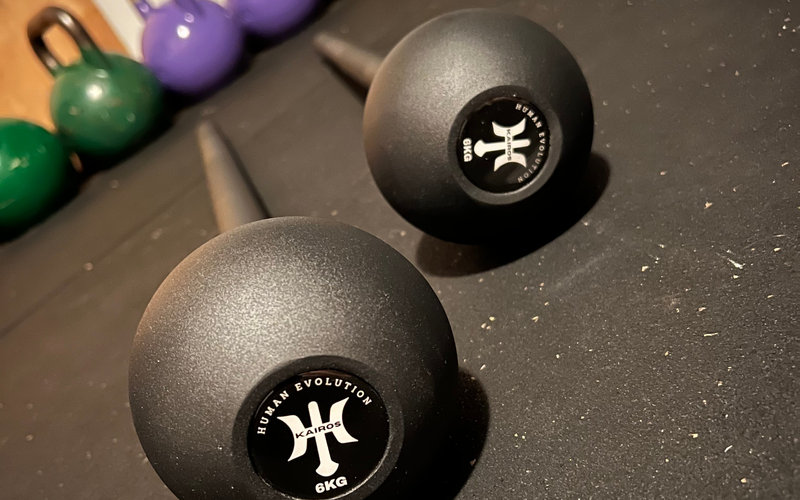 Kairos macebells on a gym floor
