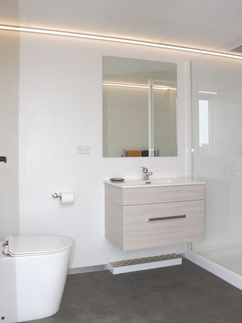 Photo of inside Trailer two (T2) looking at vanity, mirror and toilet.
