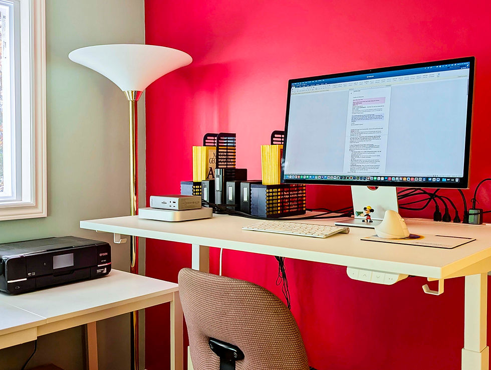 An IKEA VIHALS ($179 CAD) extendable table on the left holds my printer, phone etc.