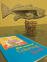 coloring book and crayons in play area