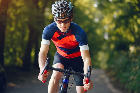 sports-man-riding-bike-in-summer-forest (1).jpg