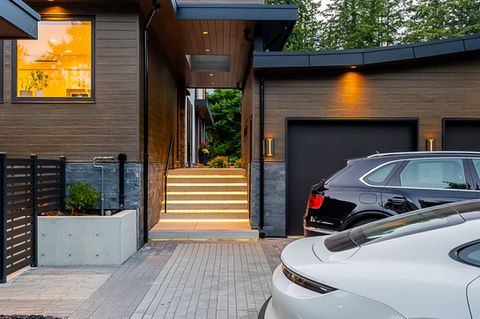 modern luxury home with concrete front stairs