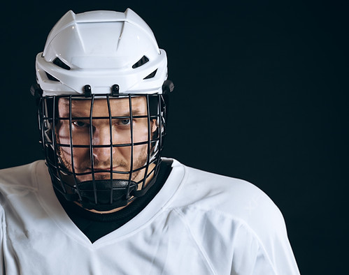 hockey player wearing helmet