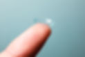 Contact lens on finger