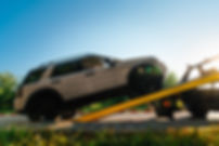 Broken car on tow truck