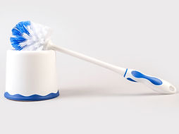 Plastic blue toilet brush isolated on white background