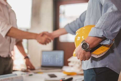 engineers shake hands for meet up and brainstorm to prepare blueprint architecture project