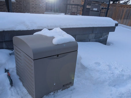 residential generator on snowy day