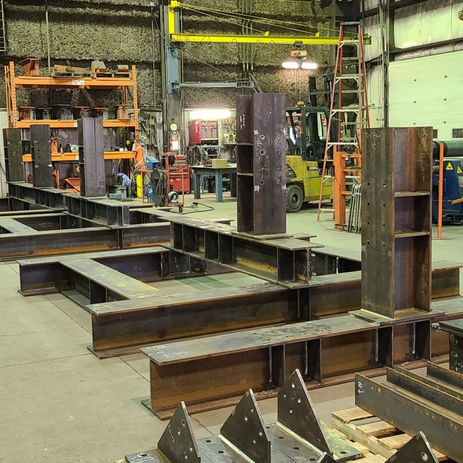 Industrial workshop with structural steel beams.