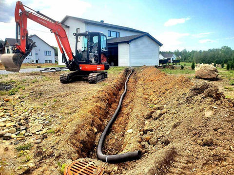 Excavatrice et drainage
