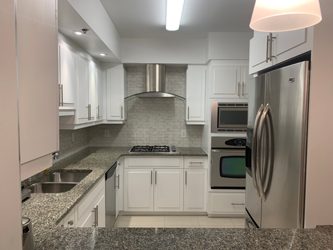 Completed kitchen renovation with repainted cabinets