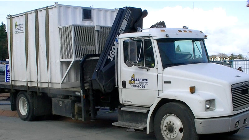 White truck with waste bin