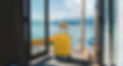 Travel suitcase with hat at house on the lake, summer beach vacation concept.