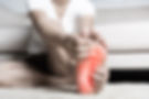 Massaging foot due to pain