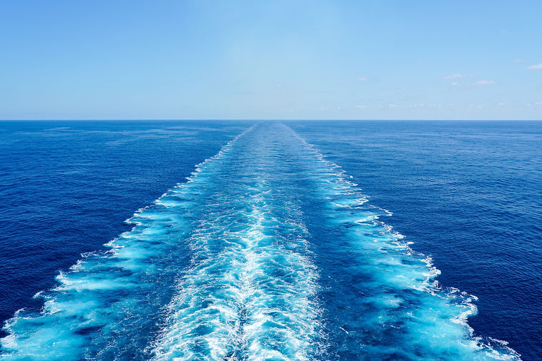 waves behind boat on water