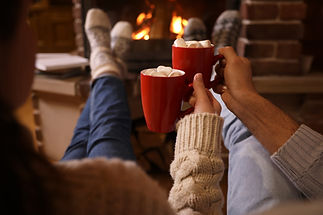 drinking coco in front of fireplace