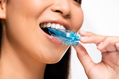 woman using mouth guard for sleep