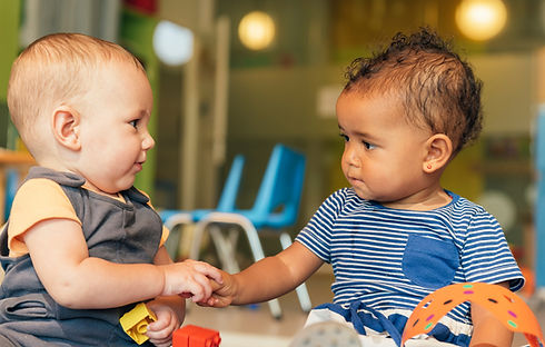 babies playing together