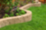landscaping with concrete retaining wall