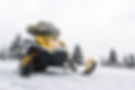 Yellow snowmobile ready for ride