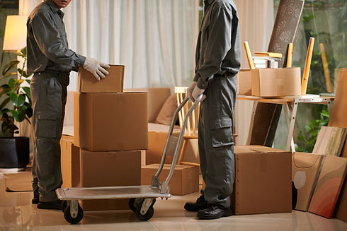 movers and boxes on a dolly