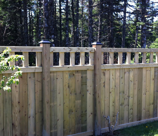 Wooden fence enclosing property