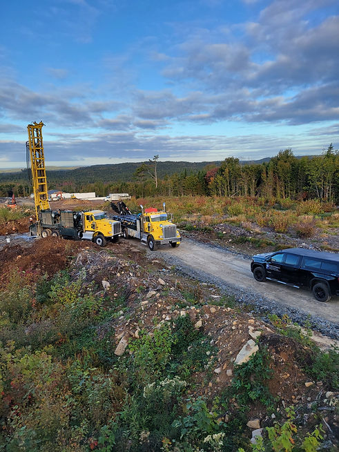yellow trucks at drilling site