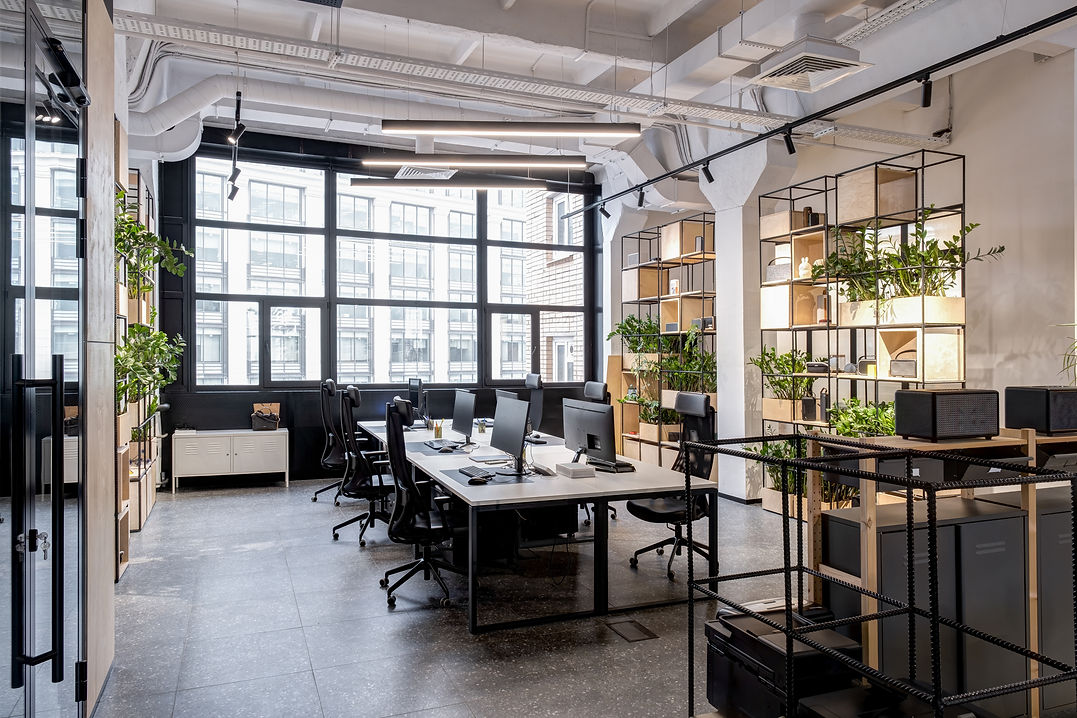 Modern open space office with lights and big windows