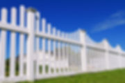 white vinyl fence on sunny day