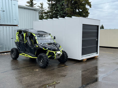 ATV next to metal shed