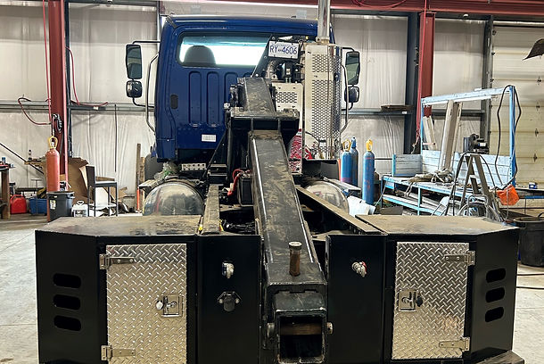 back of a flatbed truck with crane