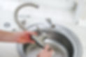 plumber's hands adjusting faucet installation
