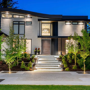 modern luxury home with concrete front stairs
