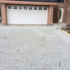 gravel driveway prepping for concrete