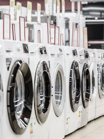 row of washing machines in store
