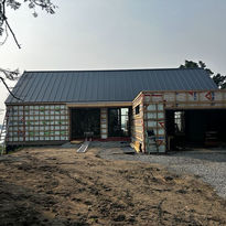 new building under construction with metal roof