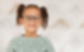 portrait of child wearing glasses smiling