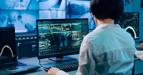 security monitor reviewing surveillance cameras