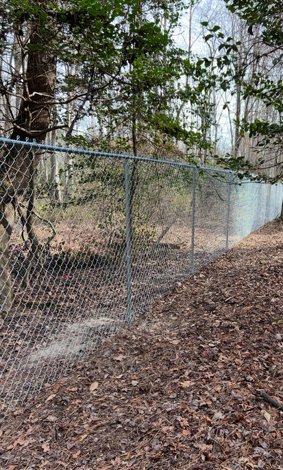 chainlink fence installation to establish property lines in between properties in Fuquay-Varina NC