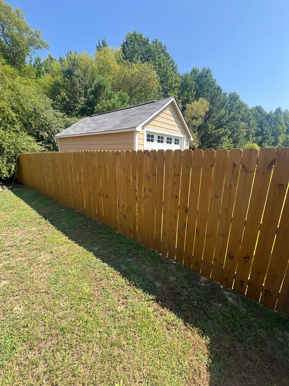 6ft wood privacy fence installed in Raeford NC and stained by our team