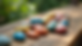 Eye-level view of a collection of colorful rocks arranged on a wooden table
