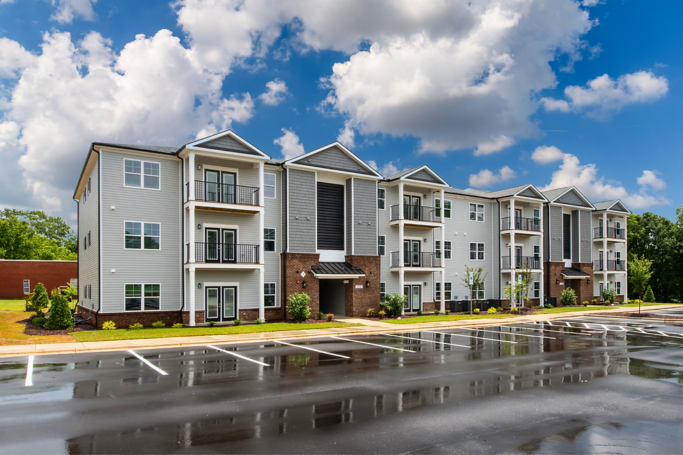 Building with clouds in sky in background
