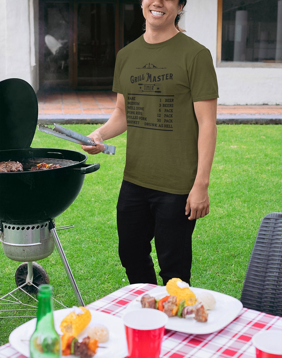 Thumbnail: Male at a grill wearing a Military Green Grill Master Timer T-Shirt.