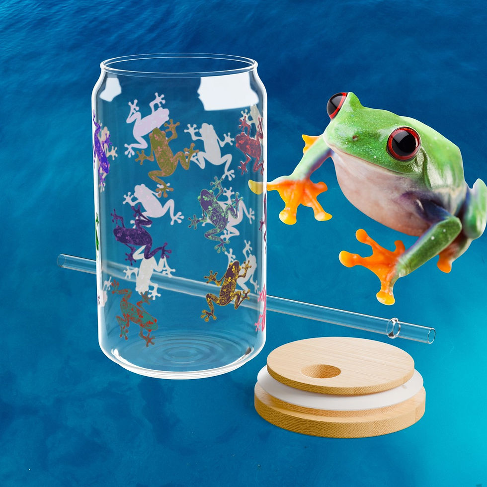 Tree frog admiring the Colorful Tree Frogs Glass Can with the bamboo lid and Tritan straw on display next to the glass.